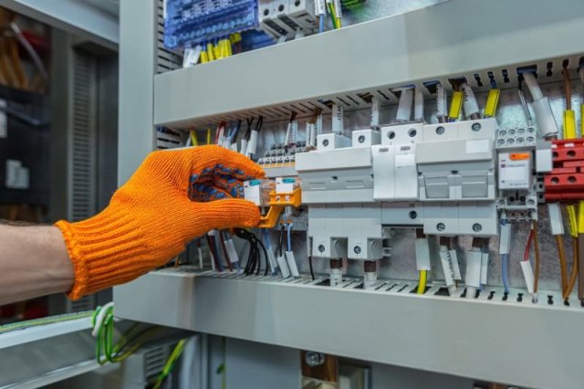 Home electrical outlet and wall switch being considered for repair