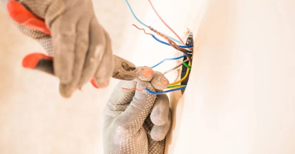 Electrical repair work on a residential outlet and wiring