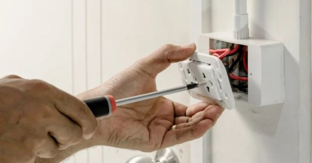 Interior lighting and electrical fixtures being reviewed in a home